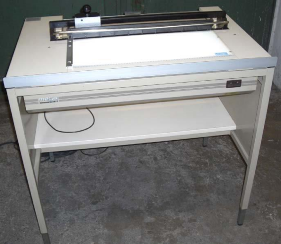 Mega steel cutter 699-2 on light table with waste box